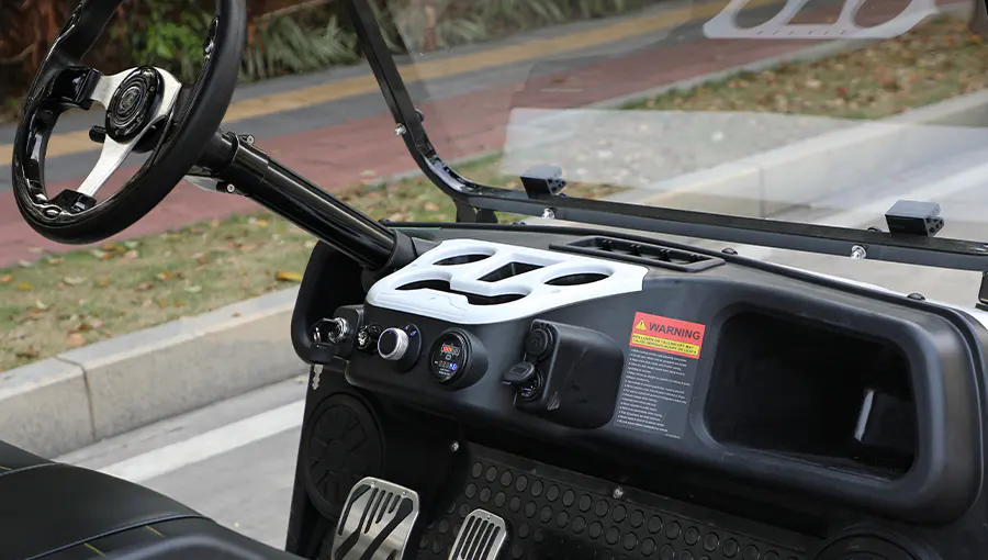 Dashboard of Tara electric medium speed vehicle featuring digital speedometer, USB charging port, and control panel