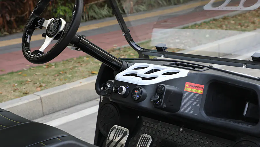 Close-up of Tara medium speed vehicle dashboard featuring digital speedometer, battery indicator, and control switches