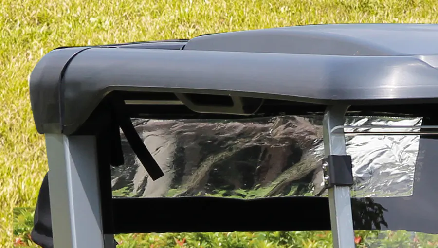 Close-up of heavy-duty injection molded canopy on Tara medium speed vehicle, designed to provide robust protection from sun and rain