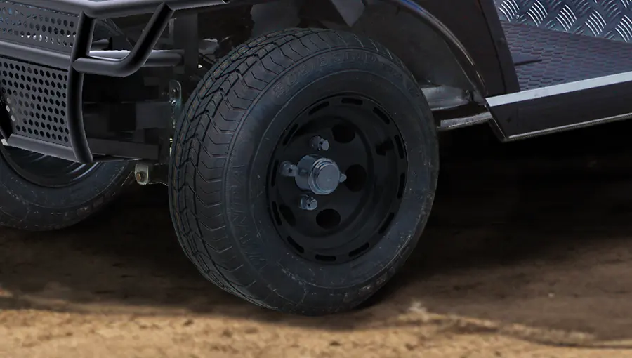 Standard road tread tire on Tara electric medium speed vehicle, designed for quiet, stable, and comfortable ride on pavement