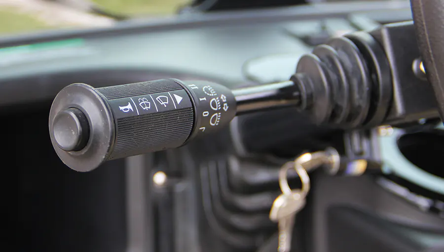 Close-up of approved switches on Tara medium speed vehicle dashboard, designed for secure and compliant operation
